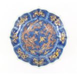Chinese porcelain lotus flower dish, hand painted with two dragons amongst clouds, six figure