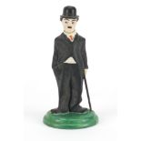 Hand painted bisque figure of Charlie Chaplin with articulated head in the style of Hassell,