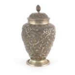 Victorian silver tea caddy by Nathan & Hayes, profusely embossed with flowers, Birmingham 1890, 16cm