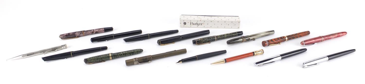 Fountain pens and propelling pencils including a Waterman's brown ripple with 9ct gold band,