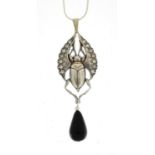 Egyptian Revival silver coloured metal beetle pendant set with clear stones and black agate drop