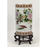 Large Chinese cylindrical porcelain floor standing vase with hardwood stand, hand painted with birds