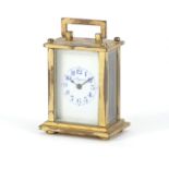 Miniature brass cased carriage clock with enamelled dial inscribed Mignon, 6.5cm high :For Further