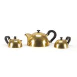 Modernist brass three piece tea set with horn handles and knops, possibly German, impressed