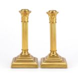 Pair of 19th century gilt metal Corinthian column candlesticks, 20cm high :For Further Condition