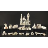 Crested china including army tank, ambulance, man in stocks and military officer, the largest 15.5cm