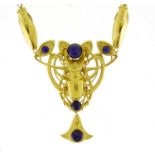 Egyptian Revival brass stag beetle and moth pendant set with lapis lazuli stones, on a necklace, the