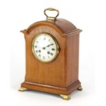 Walnut cased bracket clock striking on a gong on brass feet, with French movement, the enamelled