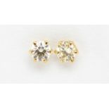 Pair of 18ct gold diamond solitaire earrings, approximately 0.56ct :For Further Condition Reports