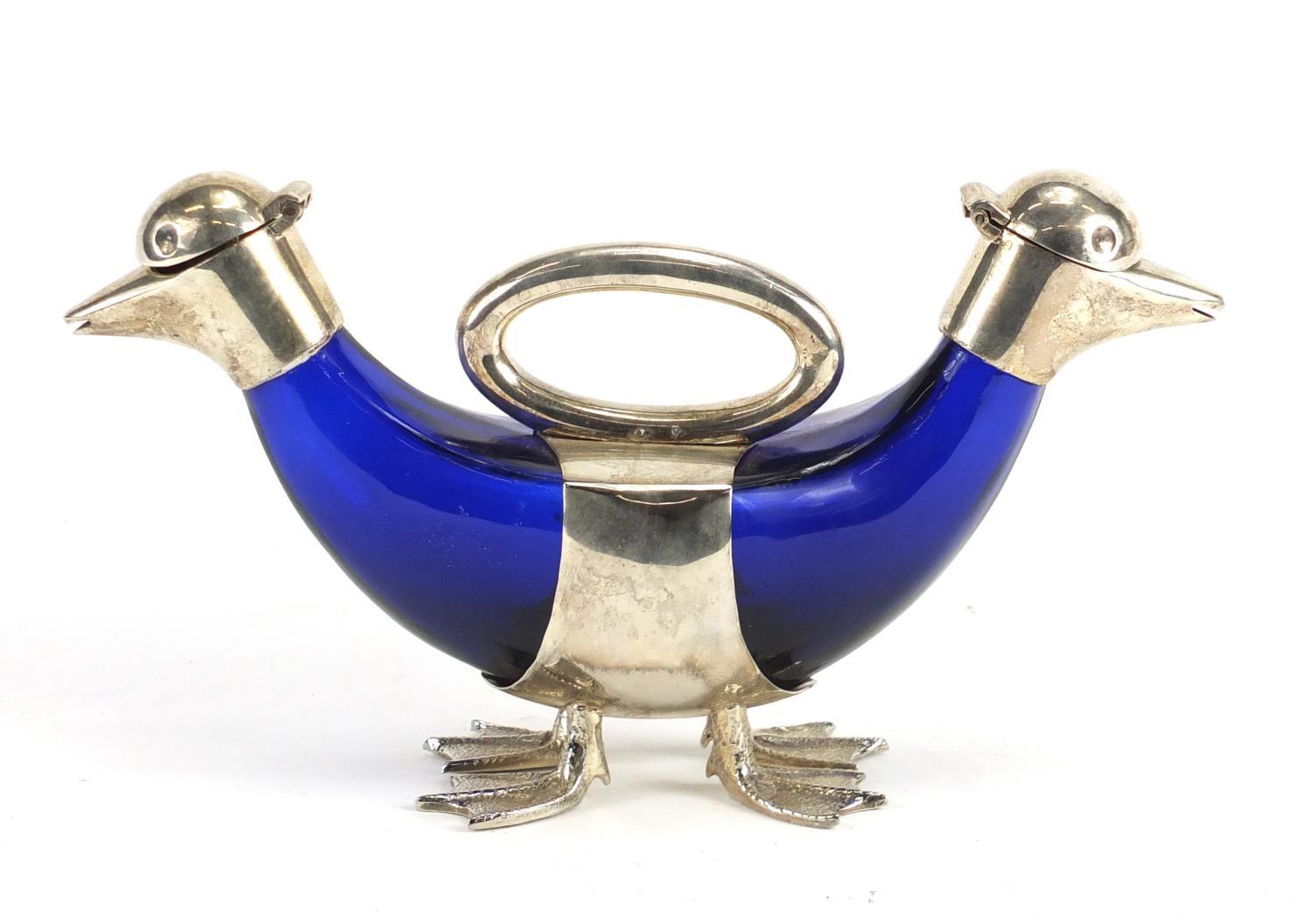 Novelty silver plated double duck decanter with blue glass body, 27cm wide :For Further Condition