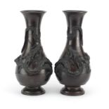 Pair of Japanese bronze baluster vases cast in relief with dragons, each 36cm high :For Further