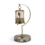 Clockwork automaton musical bird cage clock, raised on a hanging chrome and marble stand, 29cm