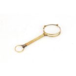 Pair of unmarked gold folding lorgnette's by Dixey & Sons of London, 12cm in length when closed,
