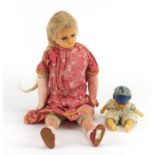 Two antique wax headed dolls including one of a boy with wax body, the largest 47cm in length :For