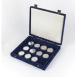 Eleven silver proof War related coins, most with certificates including some from the aircraft of