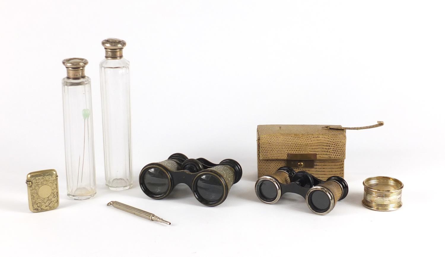 Objects including two pairs of opera glasses, two cut glass jars with silver lids and a silver