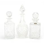 Three cut crystal decanters with stoppers, the largest 31cm high : For Further Condition Reports