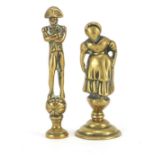 Two Victorian brass pipe tamper's in the form of Napoleon and a Victorian maid, the largest 6.5cm
