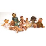 Eight vintage composite dolls, some with jointed limbs and open/close eyes, the largest 60cm