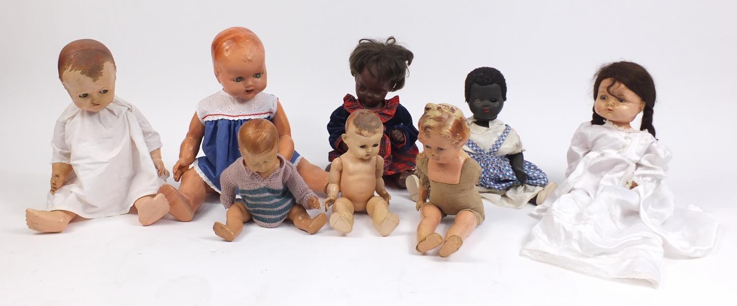 Eight vintage composite dolls, some with articulated limbs and open/close eyes, the largest 62cm