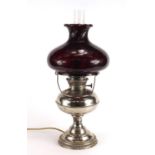 Victorian style silvered oil lamp with ruby glass shade, converted to electric use, 48cm high :