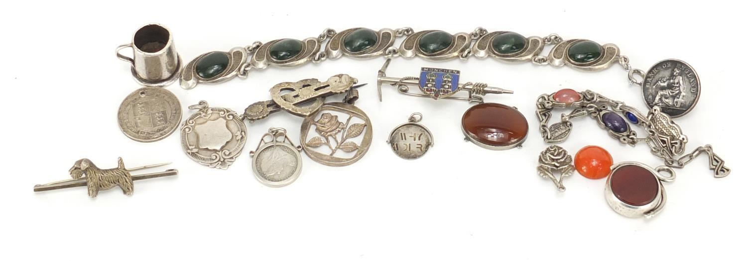 Silver and white metal jewellery including bracelet set with cabochon green hard stones, charms