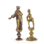 Two Victorian brass pipe tamper's in the form of two gentleman, one with a pipe, the largest 6.5cm