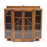 Art Deco oak bookcase fitted with four glazed doors enclosing a series of shelves, 103cm H x 106cm W