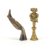 Two Victorian brass pipe tamper's in the form of a goblin and a leg with boot, each 5cm high : For