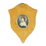 Oval portrait miniature of a young female, housed in a velvet and gilt metal frame, the miniature