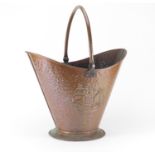 Arts & Crafts Newlyn style copper coal bucket with swing handle, embossed with ships, 36cm high