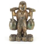 Chinese wood carving of a figure carrying a basket, 51cm high : For Further Condition Reports Please