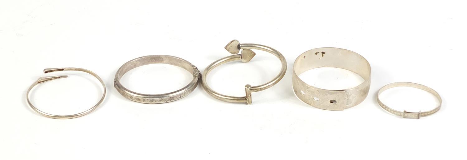Five silver and white metal bangles, 65.5g : For Further Condition Reports Please visit our - Image 4 of 6