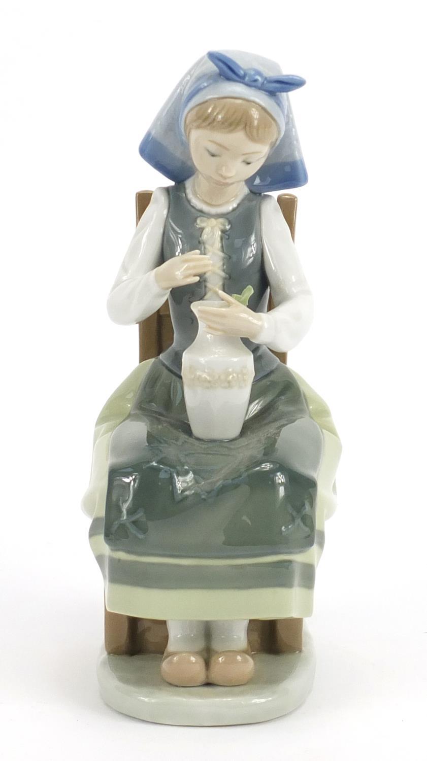 Lladro figurine of a seated girl with a vase, 21cm high : For Further Condition Reports Please visit