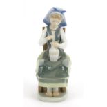 Lladro figurine of a seated girl with a vase, 21cm high : For Further Condition Reports Please visit