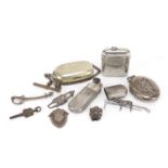 Silver and white metal objects including a large oval locket, vesta, sovereign case and brooches :