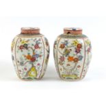 Pair of Chinese porcelain jars and covers, hand painted with birds amongst flowers, 16cm high :