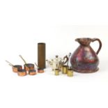 Metalwares including a large copper flagon, graduated set of pans and a trench art shell case :