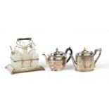 Silver plated six bottle cruet with glass bottles and two silver plated teapots, the cruet 23cm high