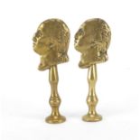 Two Victorian brass pipe tamper's in the form of two classical busts, each 7cm high : For Further
