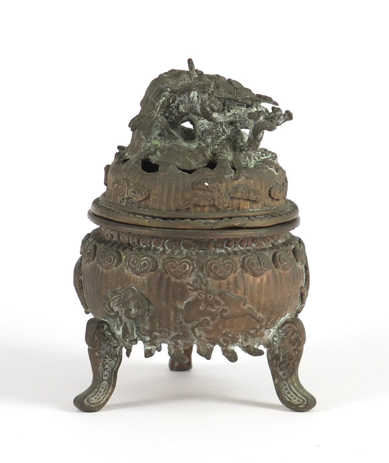 Chinese bronzed three footed Koro and cover, 12cm high : For Further Condition Reports Please