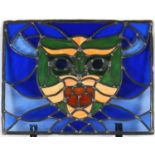 Leaded stained glass panel depicting a mask, 52cm x 40cm : For Further Condition Reports Please