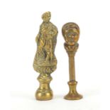 Two Victorian brass pipe tamper's in the form of gentleman and a young male bust, the largest 6cm