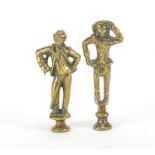 Two Victorian brass pipe tamper's in the form of a lady and a gentleman, the largest 7.5cm high :