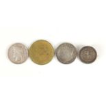 Four coins including an American coin and one German including an 1879 dollar and an 1889 double