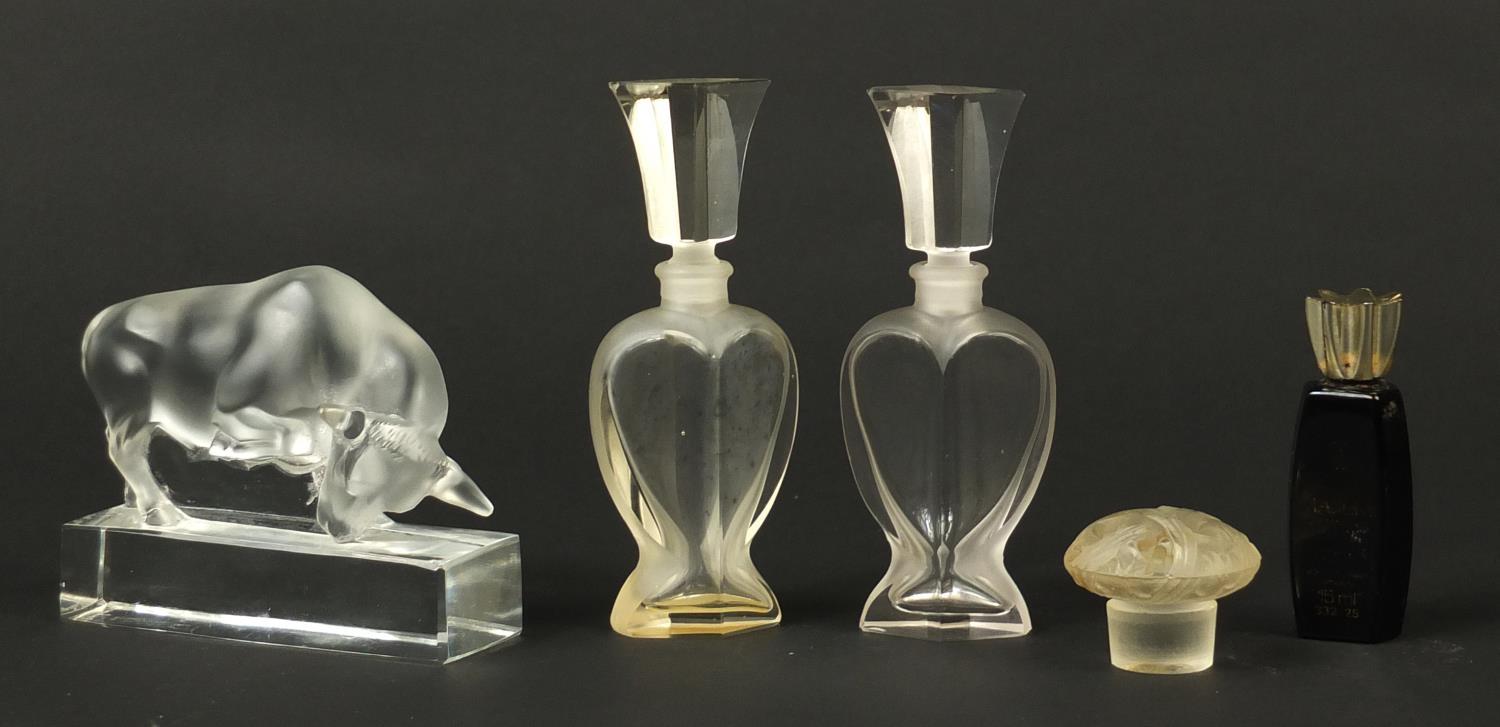 Art Deco glassware including a Lalique bull paperweight and scent bottles, the bull 11cm in length :