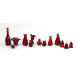 Antique and later ruby glassware including decanter with stopper, graduated set off three jugs and