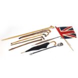Vintage and later walking sticks, parasols and a Union Jack flag, some with silver handles : For