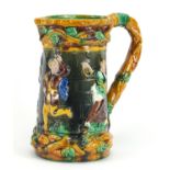Large Majolica jug, relief decorated with dancing figures, 24.5cm high : For Further Condition