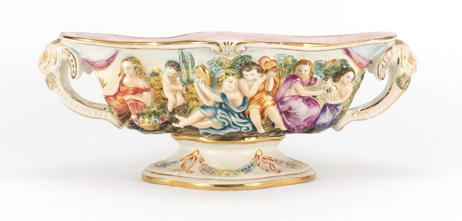 Italian porcelain centre piece with twin handles by Capodimonte, hand painted and decorated in